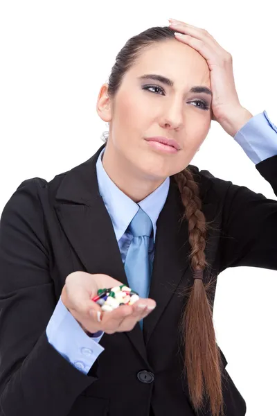 Businesswoman holding pills — Stock Photo, Image