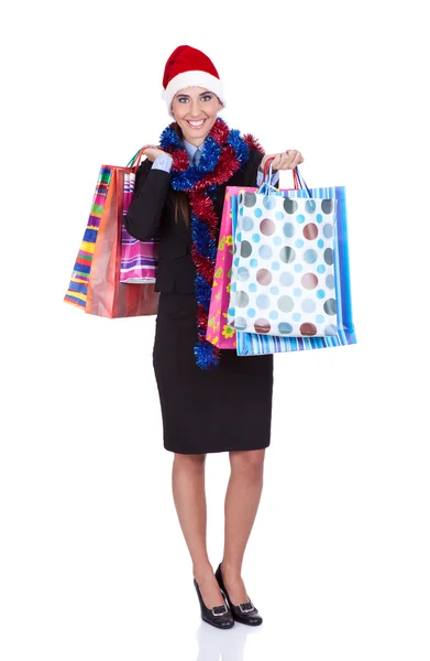 Santa menina segurando sacos de compras — Fotografia de Stock