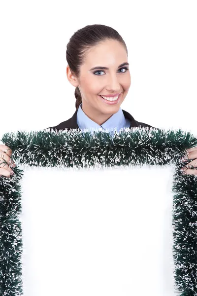 Smiling businesswoman holding christmas billboard — Stock Photo, Image