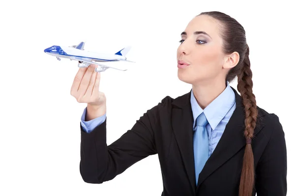 Geschäftsfrau pustet in Flugzeug — Stockfoto