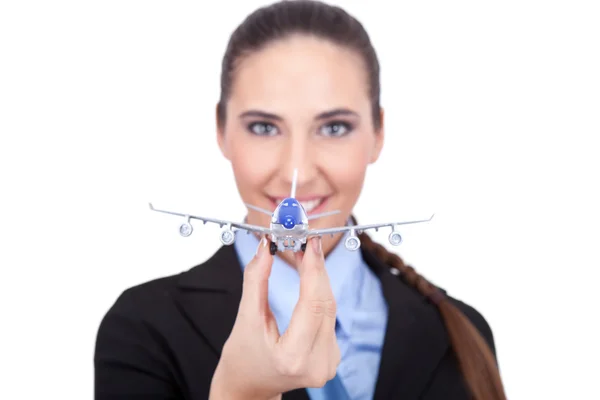 Geschäftsfrau mit Flugzeug in der Hand — Stockfoto