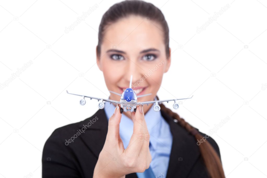 Businesswoman with plane in hand