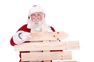 Santa Claus pointing wooden sing clipart