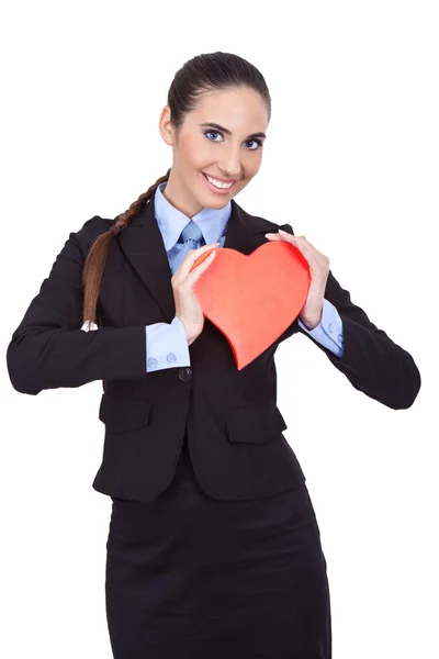 Affärskvinna anläggning röd hjärta — Stockfoto