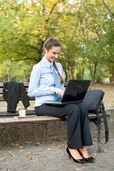 Businesswoman with laptop on break — Stock Photo, Image