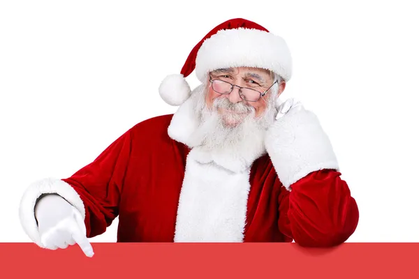 Santa claus wijzend op leeg teken — Stockfoto