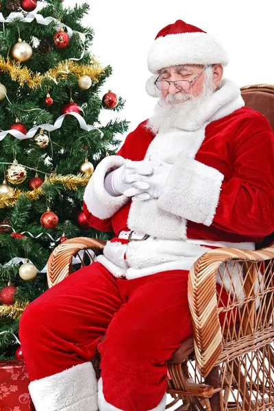 Santa spanie w jego char — Zdjęcie stockowe