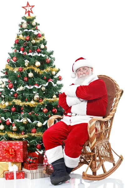 Santa claus sitter i gungstol — Stockfoto