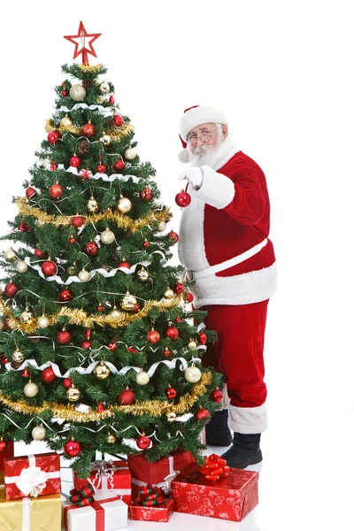 Santa claus kerstboom versieren — Stockfoto