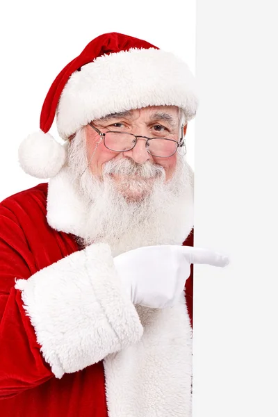 Weihnachtsmann zeigt auf leeres Banner — Stockfoto