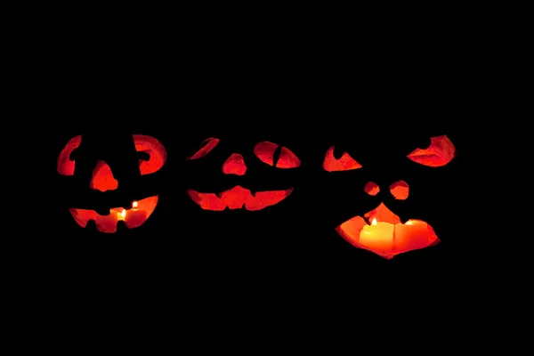 Üç korkunç jack o'lantern yüzler — Stok fotoğraf