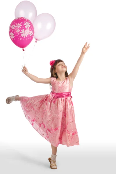 mutlu kız balon ile uçmak istiyor.