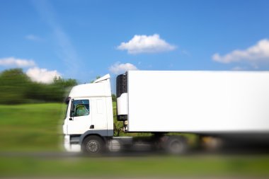 Blank white truck on the move clipart