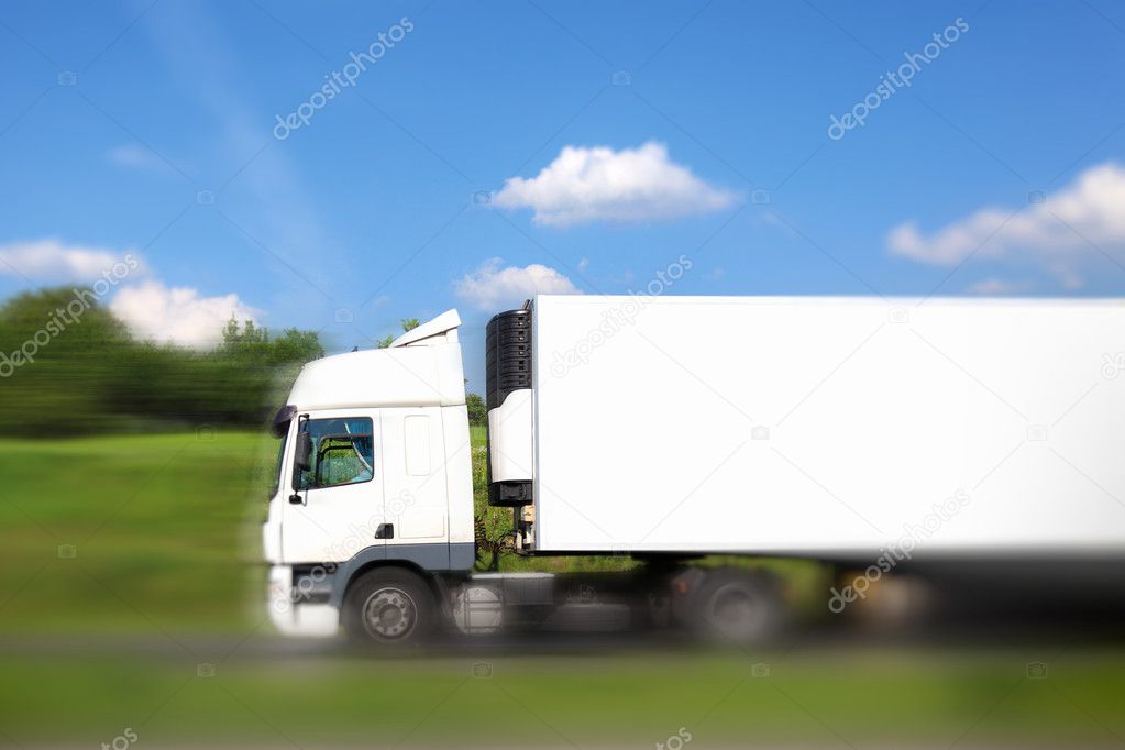 Blank white truck on the move