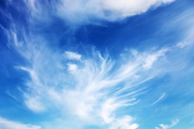 Fantastic soft white clouds against blue sky clipart