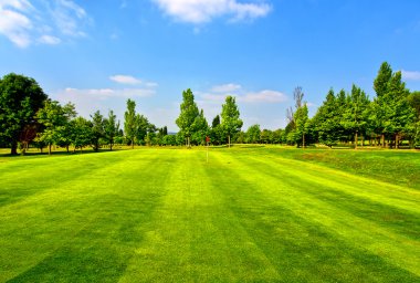 Golf course and blue sky clipart