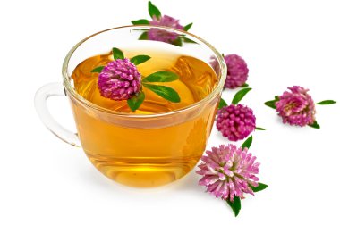 Herbal teas with clover in a glass cup clipart