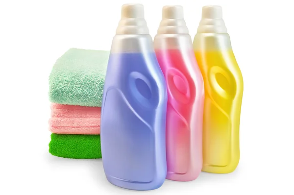 Fabric softener with a stack of towels — Stock Photo, Image