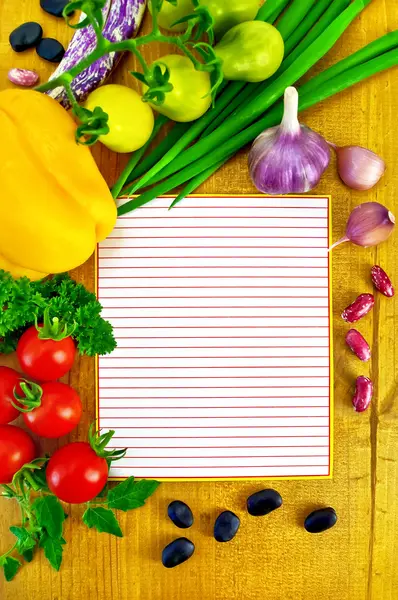 Notepad with vegetables and beans — Stock Photo, Image