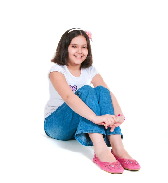 The girl sits on a white background — Stock Photo, Image