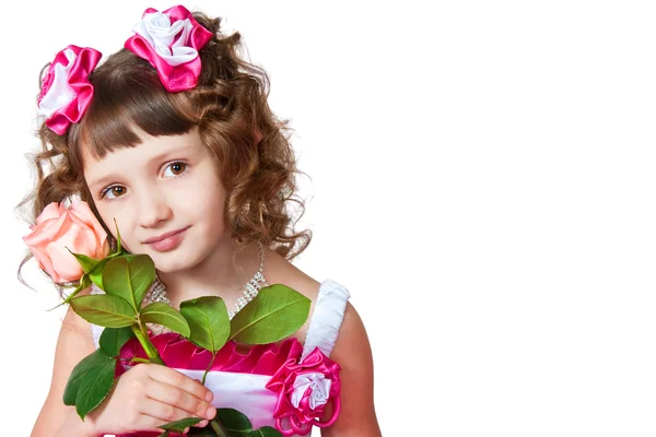 Het meisje in een mooie jurk met roos — Stockfoto