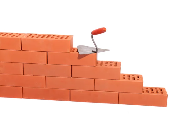Red bricks and trowel — Stock Photo, Image
