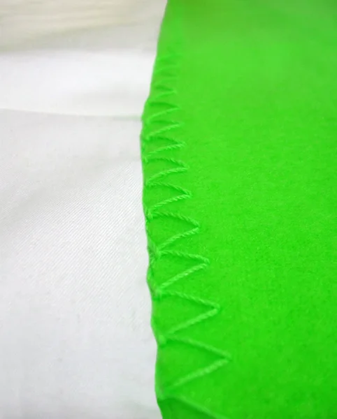 Streszczenie szew zielony krawędzi, włókienniczych szczegóły. — Zdjęcie stockowe