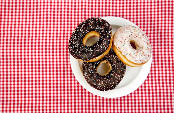 A couple of donuts on table. — Stock Photo, Image