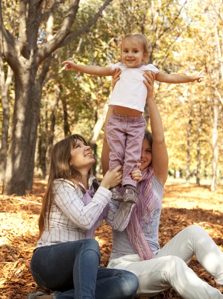 Girlfriends and little child at the park. — Stock Photo, Image