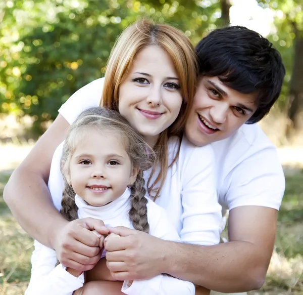 Young family outdoor. — Stock Photo, Image