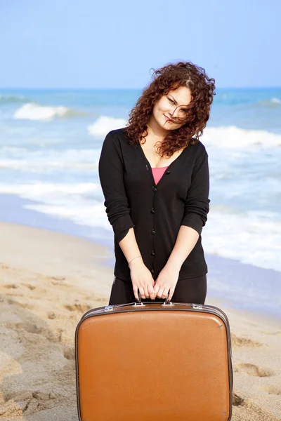 Redhead girl at outdoor with suitcase — Stock Photo, Image