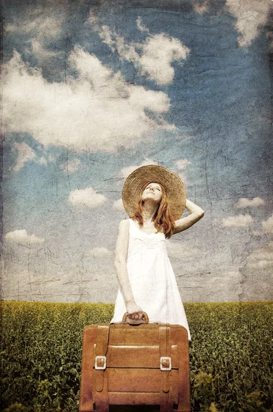 Lonely girl with suitcase at country. — Stock Photo, Image