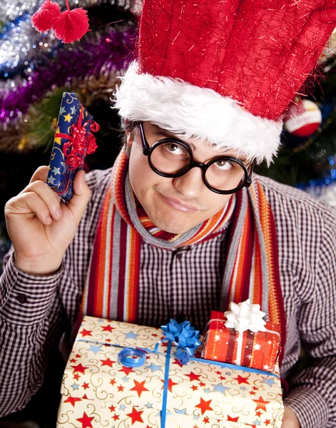 Funny men in christmas cap with gift boxes — Stock Photo, Image