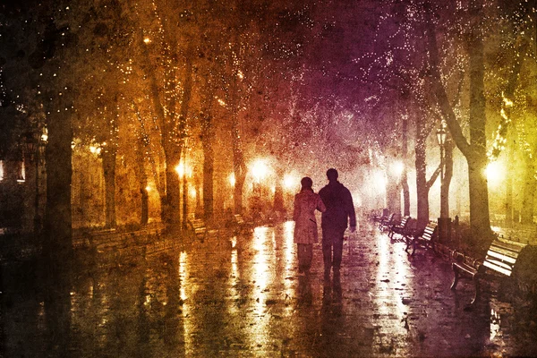 Casal andando no beco em luzes noturnas . — Fotografia de Stock