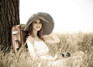 Girl sitting near tree with vintage camera clipart