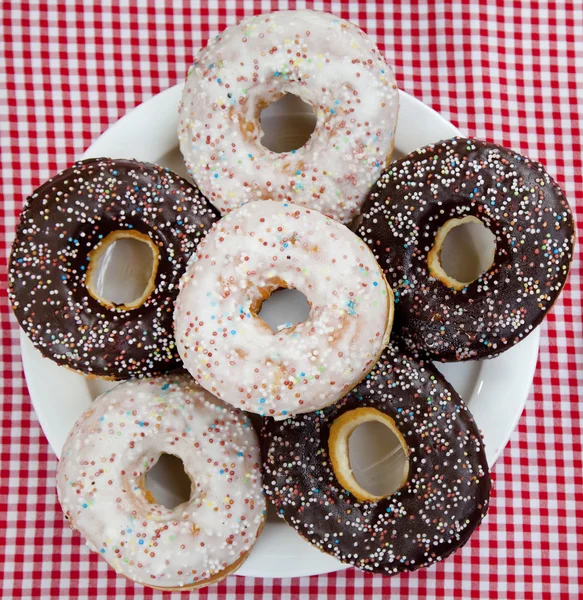 A couple of donuts on table. — Stock Photo, Image