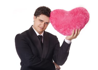 A man holding toy heart in formal black tux with tie isolated on clipart