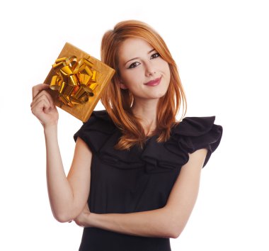 Red-haired girl in dress with present box at white background.