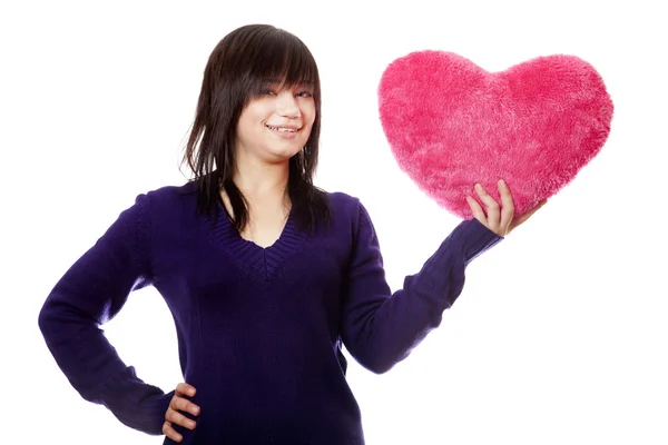 Beautiful brunette girl with toy heart. — Stock Photo, Image