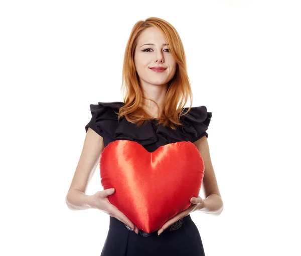 Beautiful red-haired girl with toy heart — Stock Photo, Image