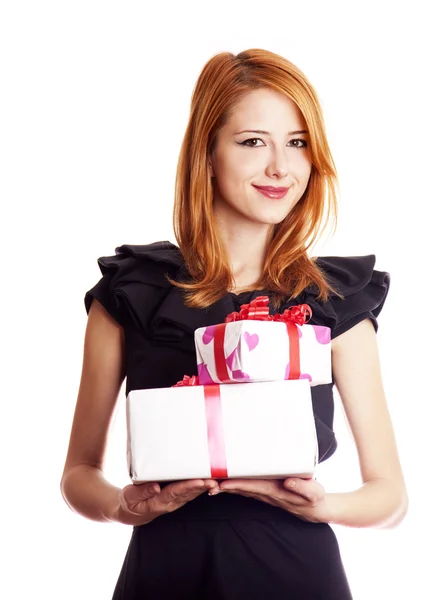 Beautiful red-haired girl with present boxes. — Stok fotoğraf