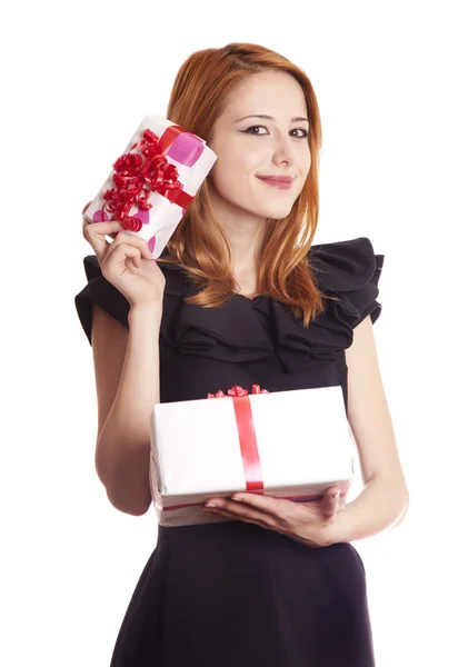 Beautiful red-haired girl with present boxes. — Stok fotoğraf