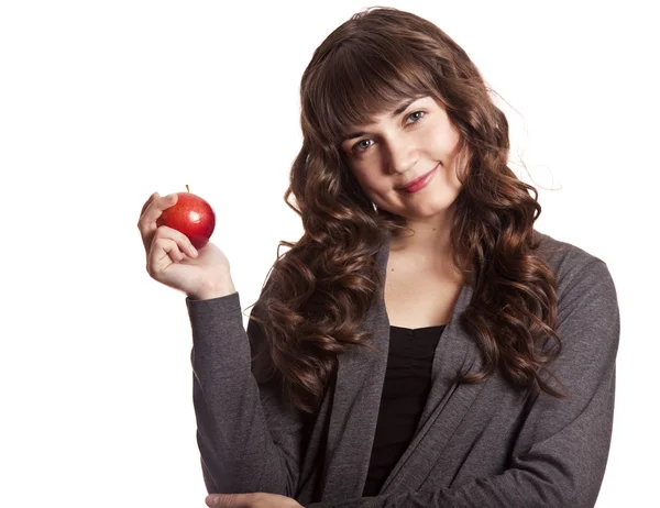 Brunett tjej med äpple i handen. — Stockfoto