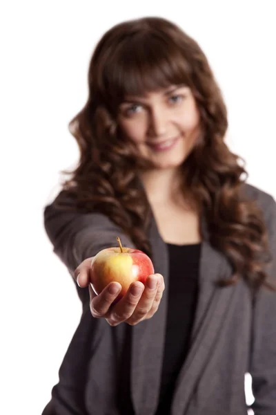 Brunette girl with apple in hand. — Stock Photo, Image