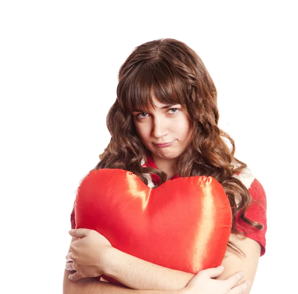 Sad brunette girl with toy heart. Photo for st. Valentine post c — Stock Photo, Image