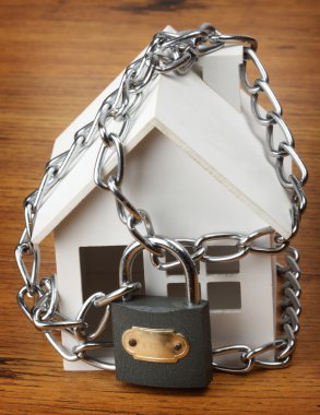 House with chain and padlock, clipart