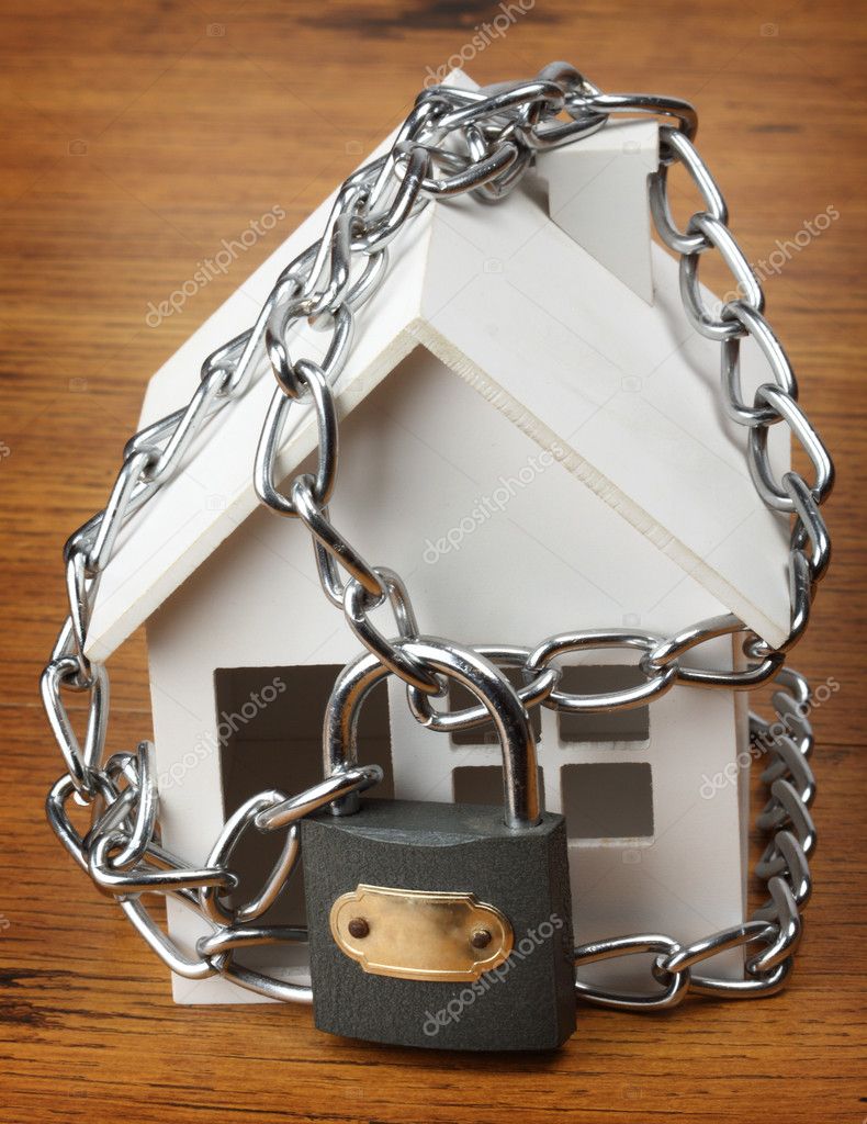 House with chain and padlock, — Stock Photo © AlexKosev 7282292