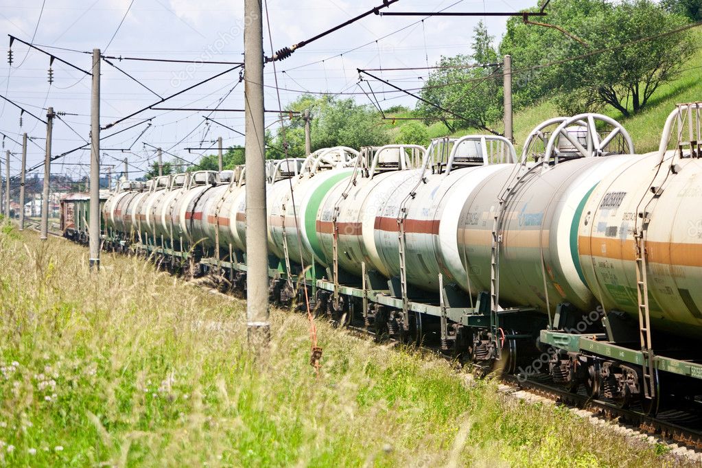 Passing cargo train with structure of cars - tanks