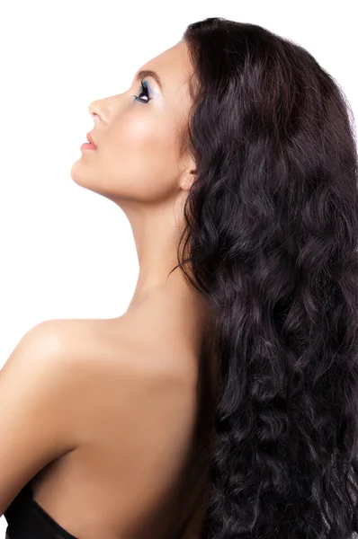 Uzun kıvırcık saçlı genç kadın — Stok fotoğraf