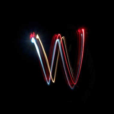 Letter W made from brightly coloured neon lights clipart